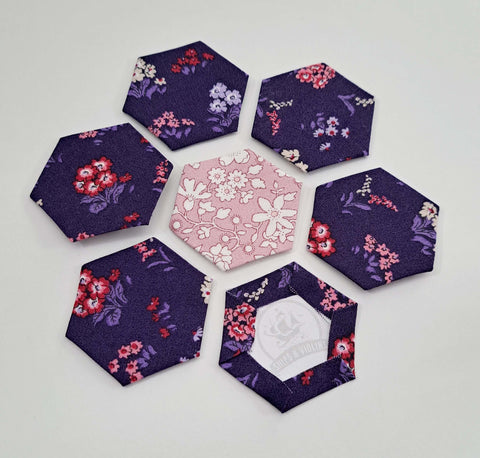Photo of seven fabric hexagons for english paper piecing