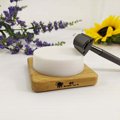 Shave soap on soap dish with razor
