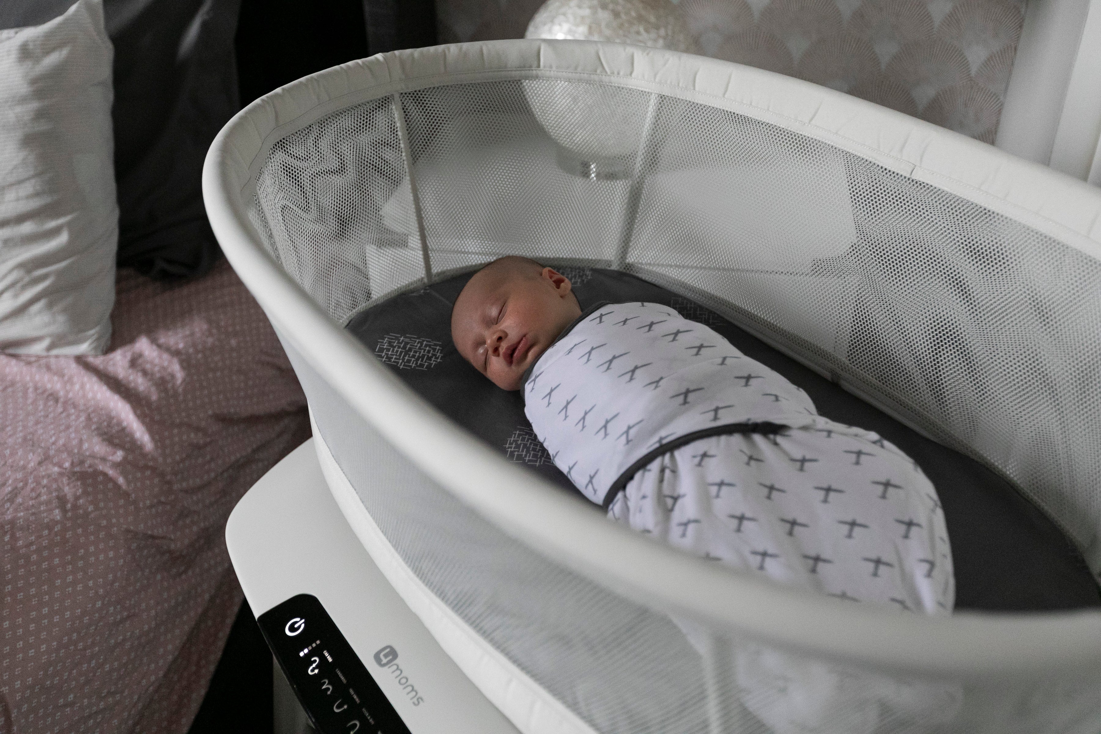 baby sleeping in bassinet