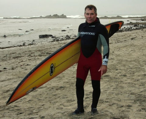 Jeff Clark with Surfboard at beach