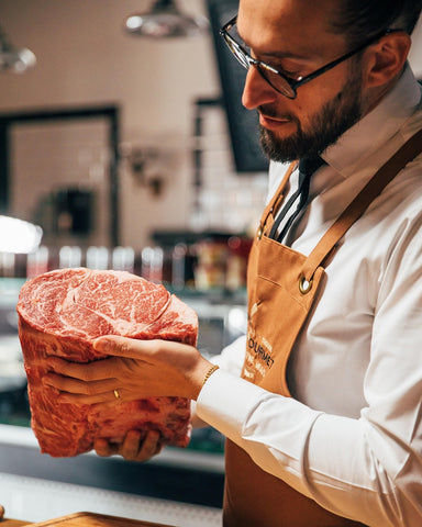 Head Chef holding up a piece of stockyard australian wagyu beef
