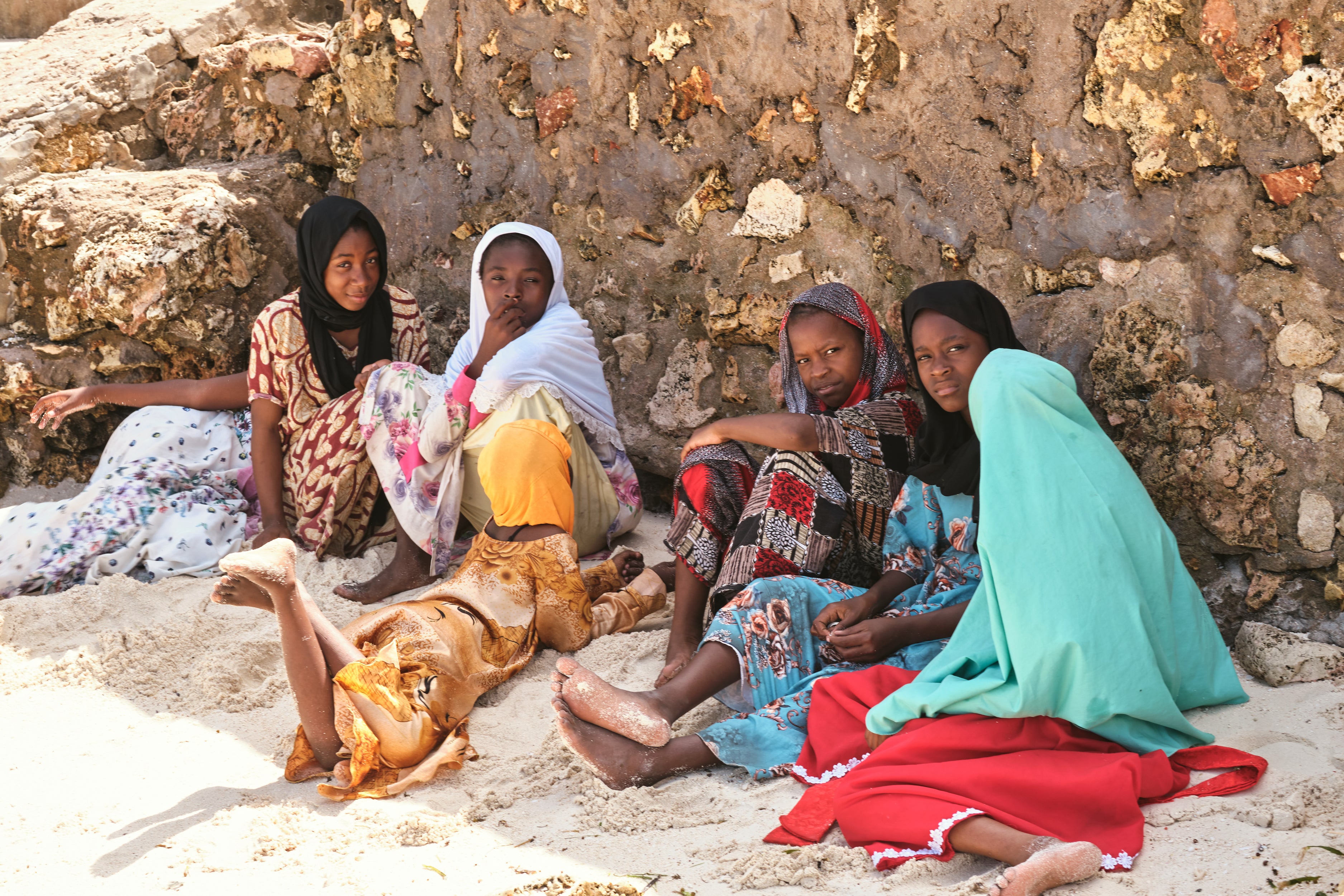 Island Tribe _ Young beautiful swahili girls seated on Nungwi Beach _ Zanzibar 