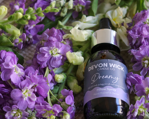 dreamy pillow spray in a bed of purple flowers