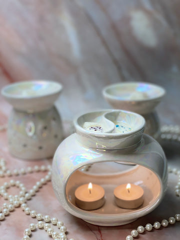 lustre duo melter in centre with snow pixie soy wax melt. star lustre melter and home sweet home soy wax melter behind it.