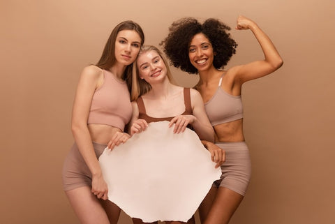 young girls with shapewear different nationalities hold
