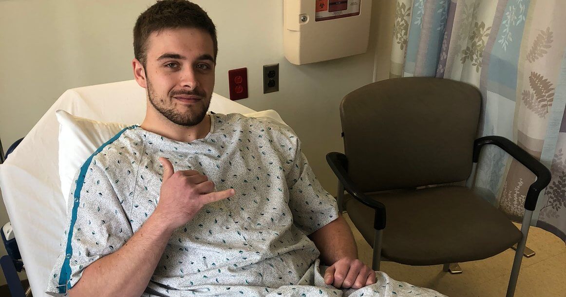 Joey Berardi in a hospital bed before testicular cancer surgery