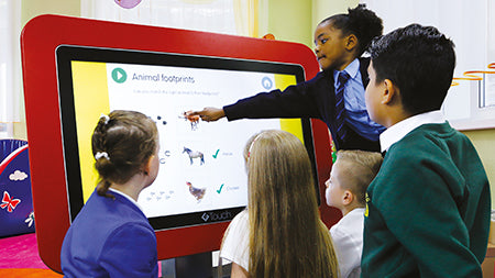 image of a group of kids using the red Genee Touch Table