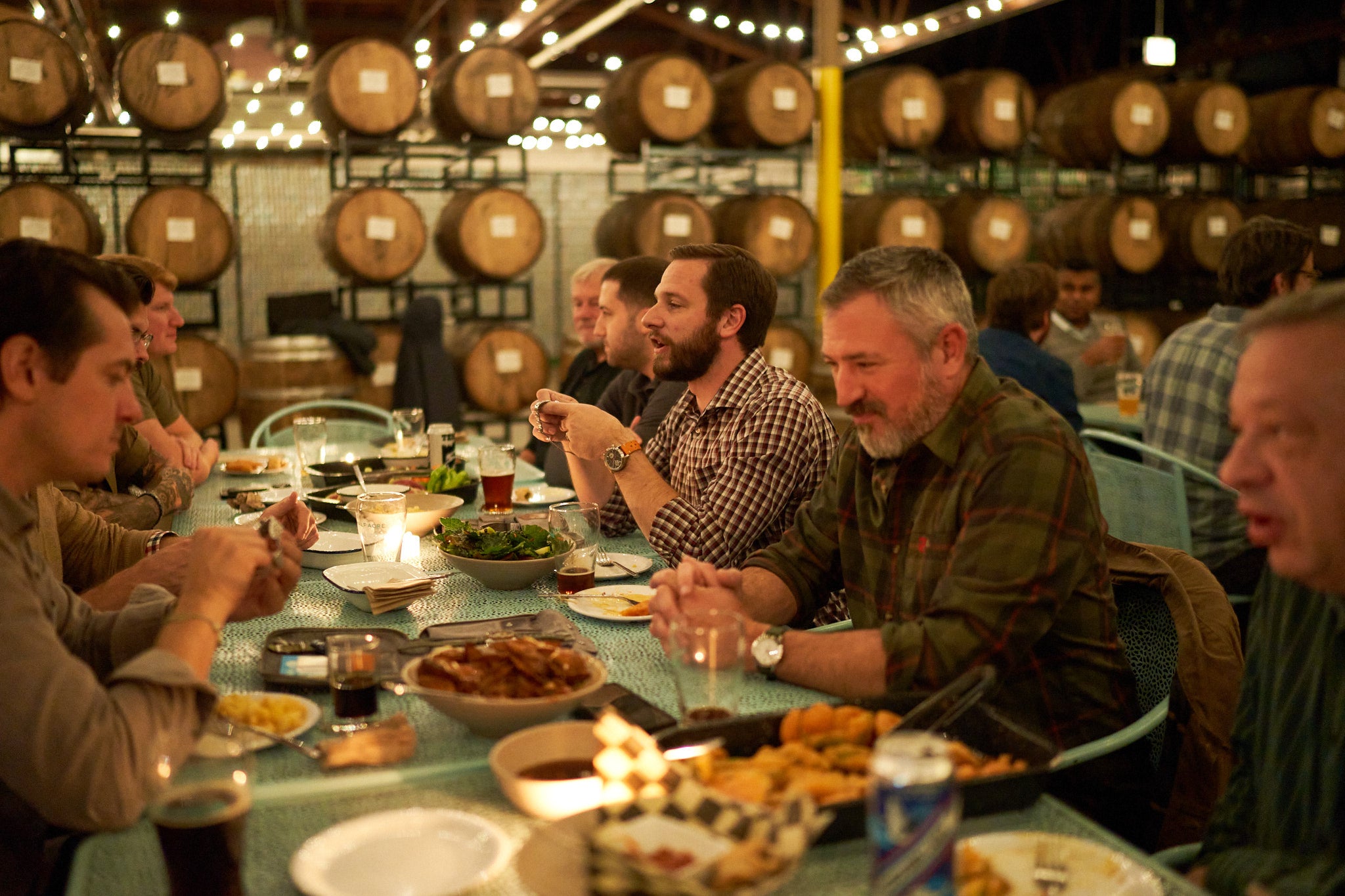 Guys sitting at dinner table