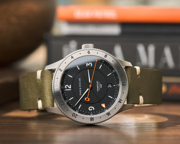 Sage green leather watch strap on Oak & Oscar black dial Humboldt GMT