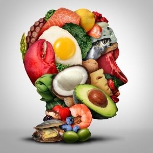 Collection of healthy foods arranged in the shape of a human head