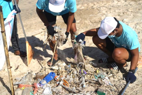 beach cleanup of various pieces of trash