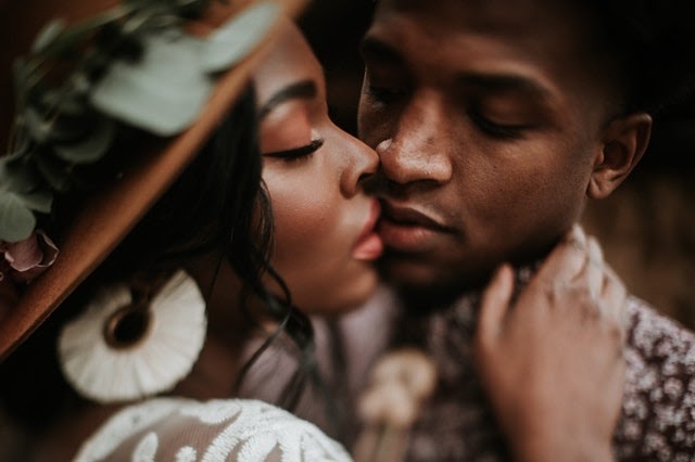 black woman and black man kissing | The Guilty Woman