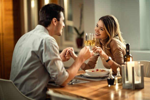man and woman toasting on a date | The Guilty Woman