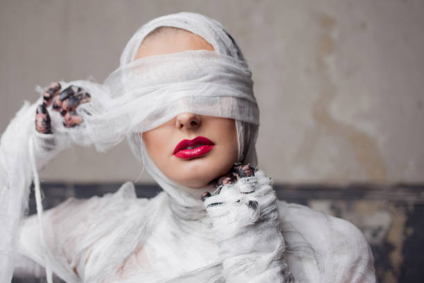 cover photo of a woman dress as a mummy costume