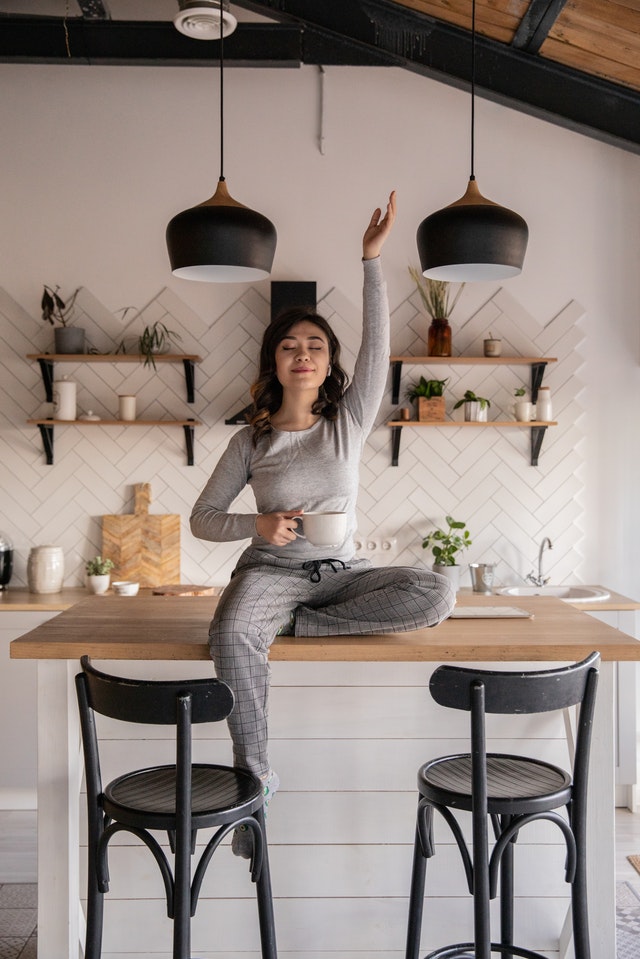 woman holding cup and wearing pajamas_ The Guilty Woman