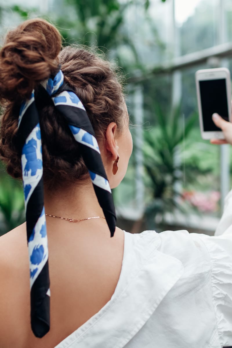 a woman with scarf in her hair