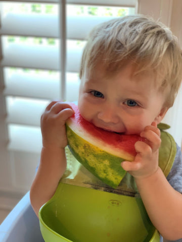 Working pumping mom - Natallia Pinchuk's son eating watermelon