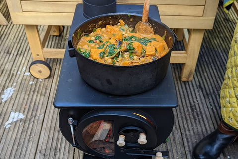 Cooking sweet potato curry on top of the Anevay Frontier Stove