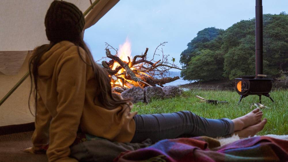 Anevay woodburning stove set up outside a tipi