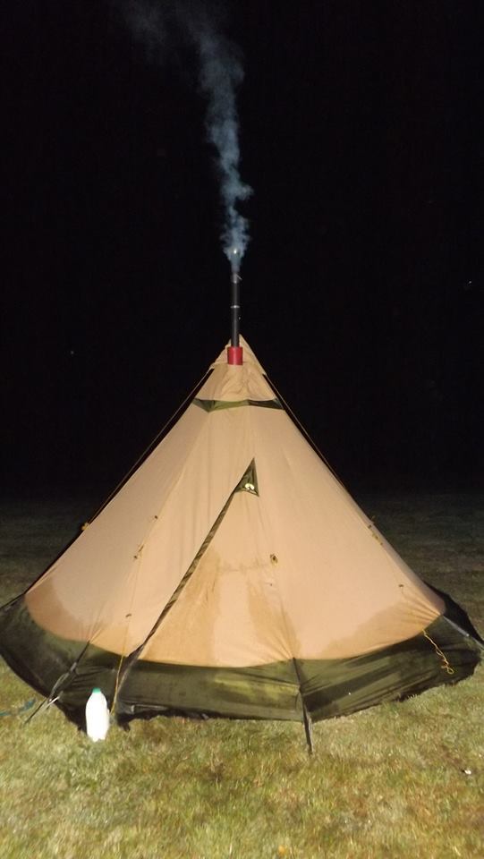 Tipi set up with woodburning stove