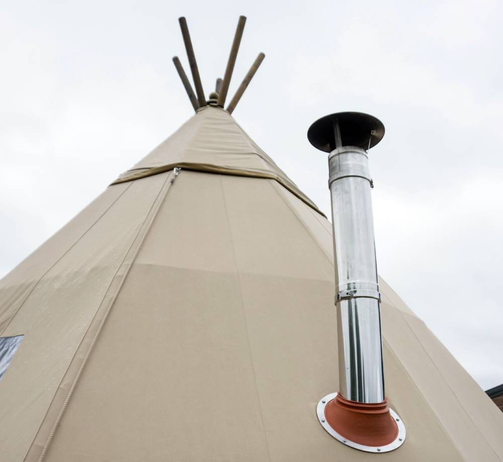 Stove flue installed in a tipi