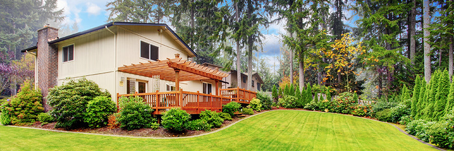 Backyard covered deck and large lawn