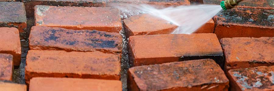 cleaning bricks with sprayer