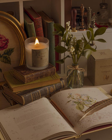 High Cottage candle with old books and a quill pen
