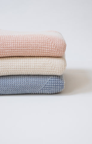 Echoview Fiber Mill baby blankets, stacked in three colors.