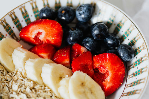 Healthy eating a bowl of fruit and oats