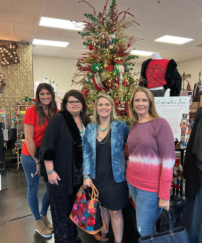 Three VIP shoppers with Queen Bling owner, Stacey at the annual Sip, Shop, Sparkle Holiday Shopping Event. 