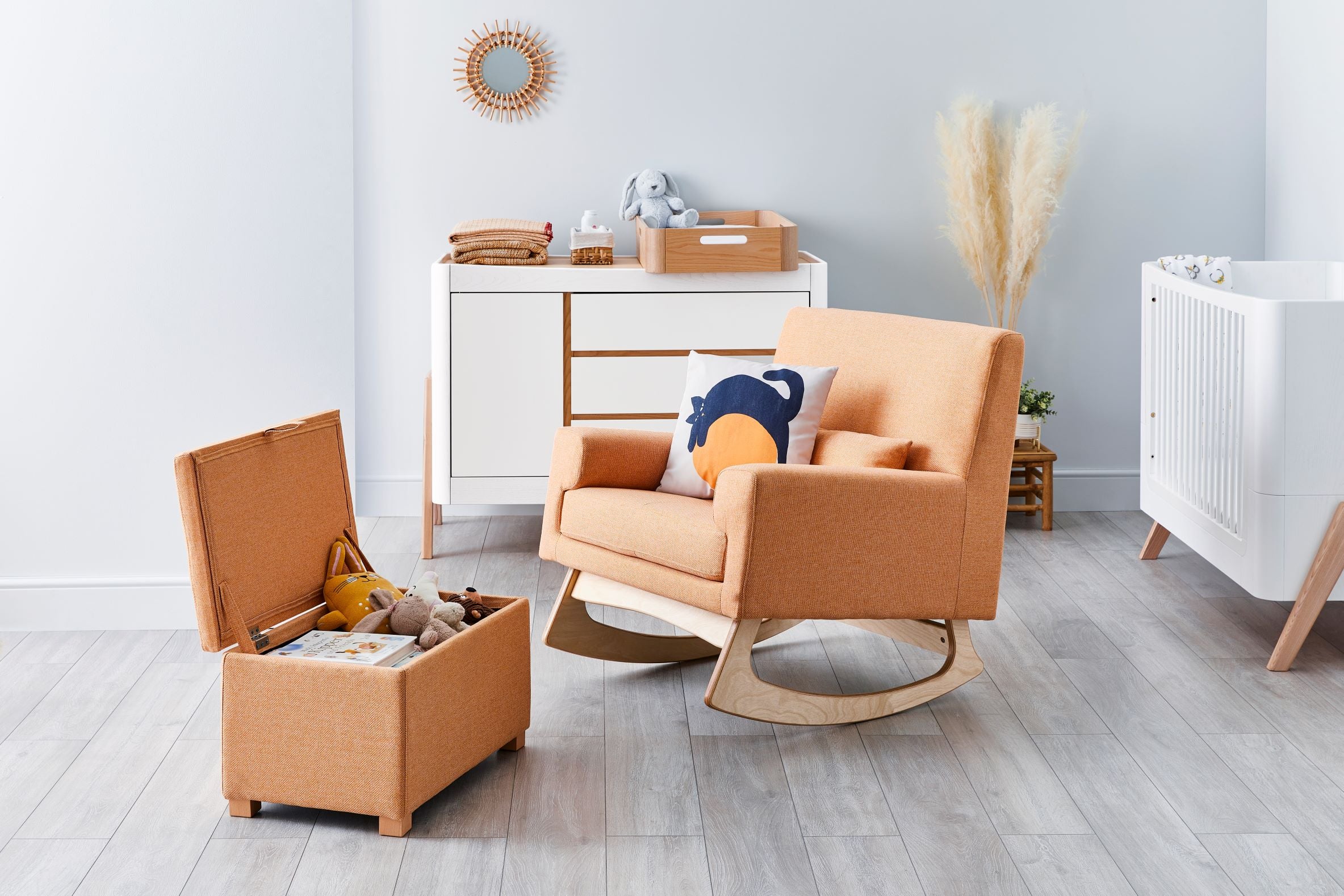 Gaia Baby Serena Nursing and Rocking Chair in Ochre. Gaia Baby Serena Footstool with storage in ochre. Lifestyle image of a minimalist nursery