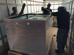 custom aquarium being loaded on a box truck for shipping