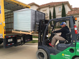 crated aquarium being moved with a forklift