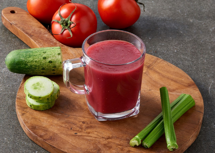 vegetable juice with cucumber, tomatoes, and celery
