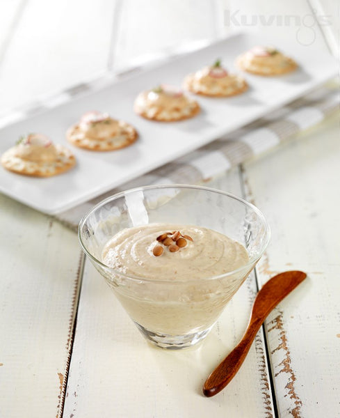 Hummus in glass bowl