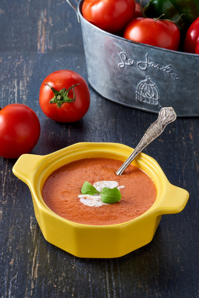 tomato soup in a yellow bowl