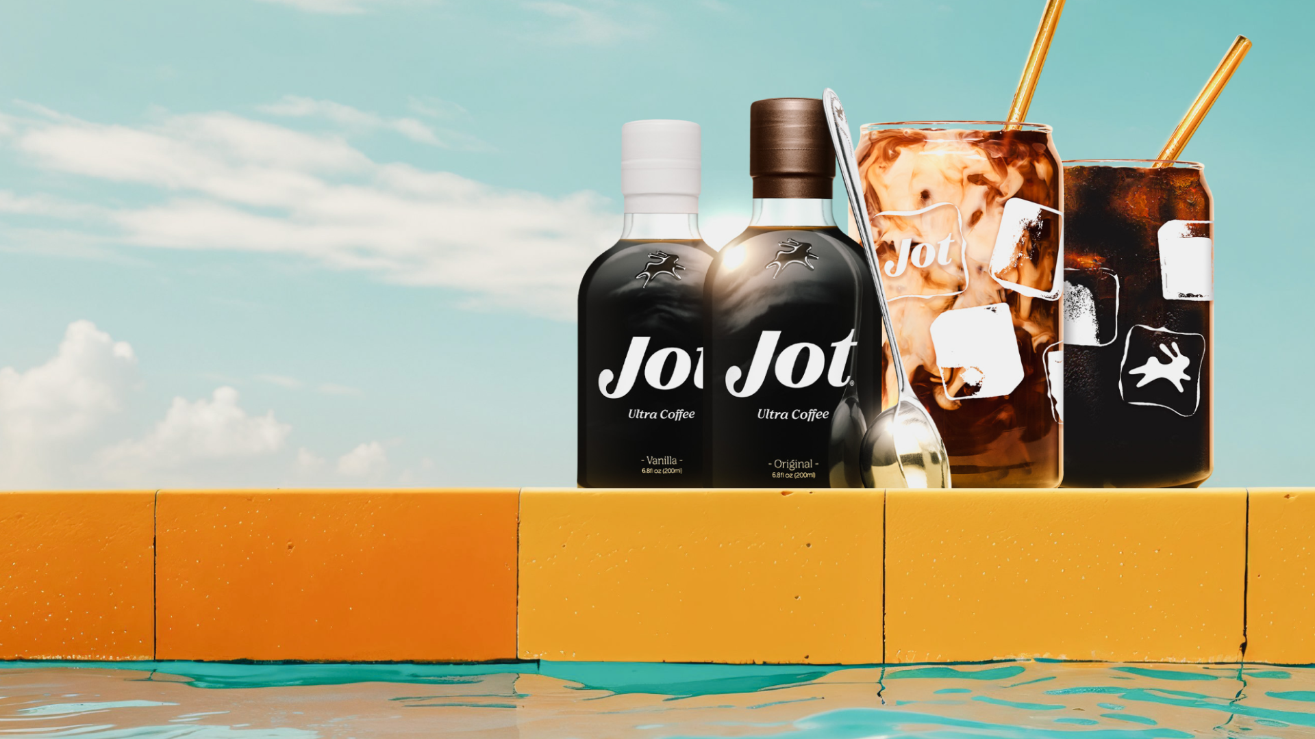 Two bottles of Jot Ultra Coffee and iced drinks by a pool edge with a blue sky background.