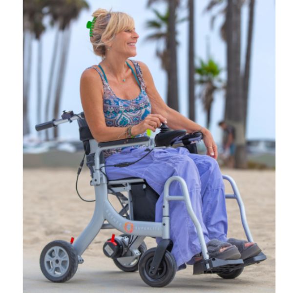 A Woman Sitting in the Reyhee Superlite Wheelchair Showing the Right Side View of the Wheelchair