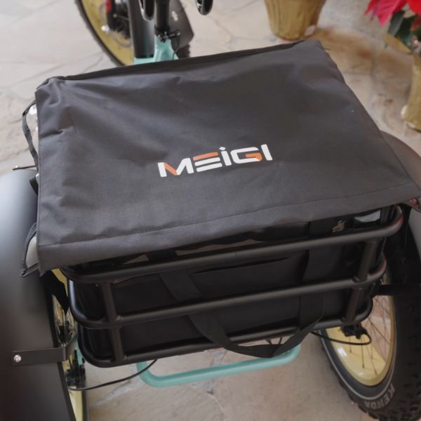 A Rear View of the Tricycle with a Bag Attached to the Rear Rack