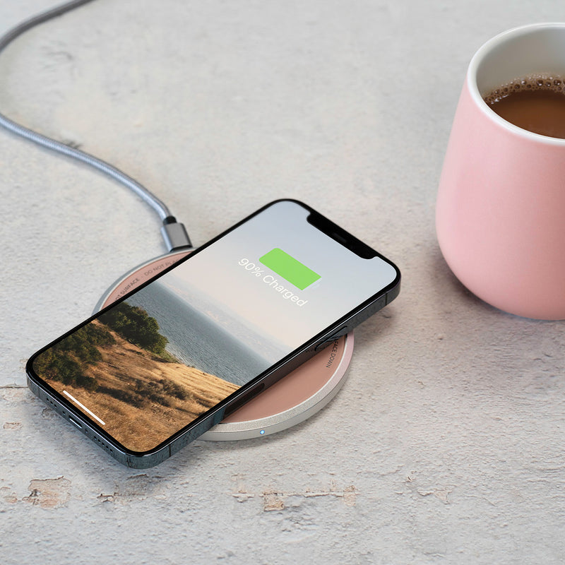 This self-heating mug system double as a wireless phone charger