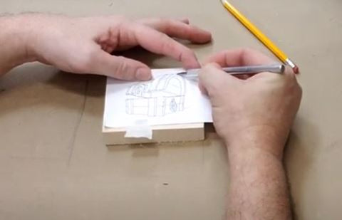 Go over the carving pattern with your metal stylus