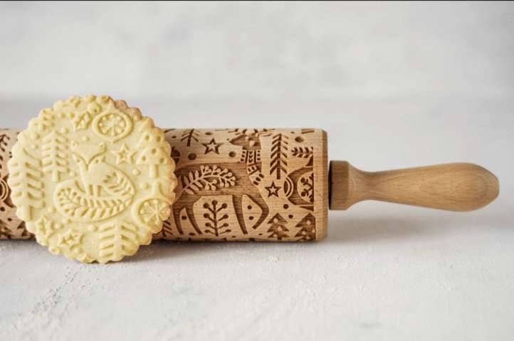 Christmas rolling pin and a cookie