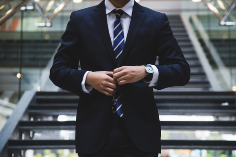 Photo by Hunters Race man in business suit