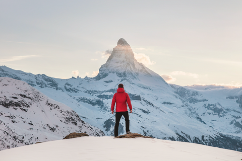 man on top of a mountain looking out