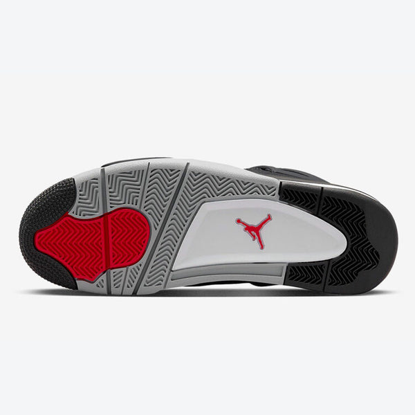 Sole of the Air Jordan 4 SE 'Black Canvas' sneaker shot against a studio backdrop