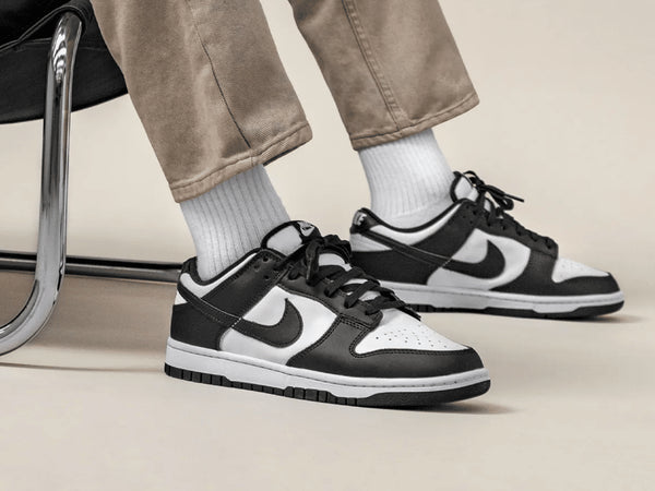 Nike Dunk Low Panda sneakers worn on feet