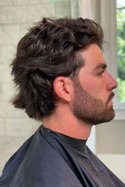 man with curly modern mullet