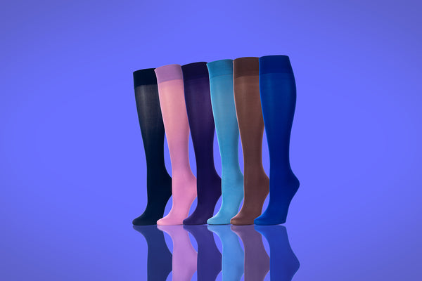 Colorful Compression Socks Presented In Various Colors With Royal Blur Background