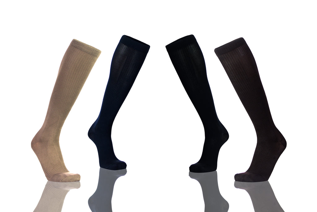 Wearing Compression Socks  - Image Showing Four Socks In Different Colors With White Background